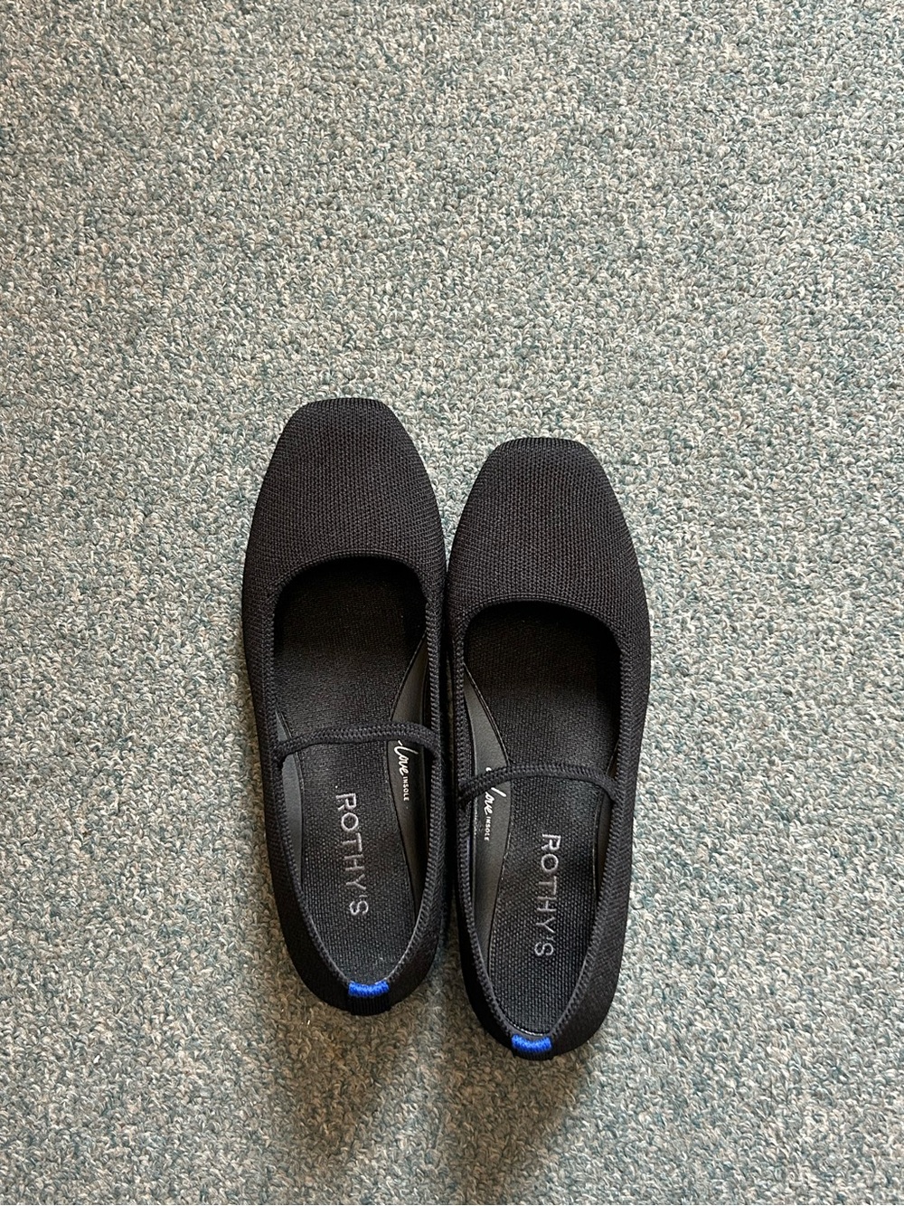 Rothy's Black Ballet Flats with Blue Heel Tab
